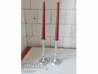 Two metal candlesticks.