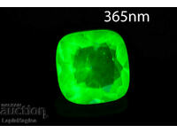 Hyalite opal 0.67ct 5.8mm cushion cut fluorescent