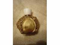 I sell an old bottle of perfume with metal casing and gilding