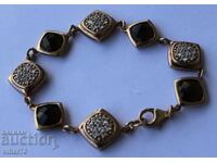 Silver branded bracelet with gold plated 0.4 micron rauchtop stones
